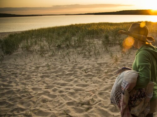 Walking a Lake Superior beach at sunset in Munising, Michigan.